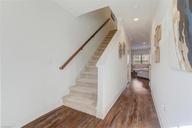 stairs with wood-type flooring