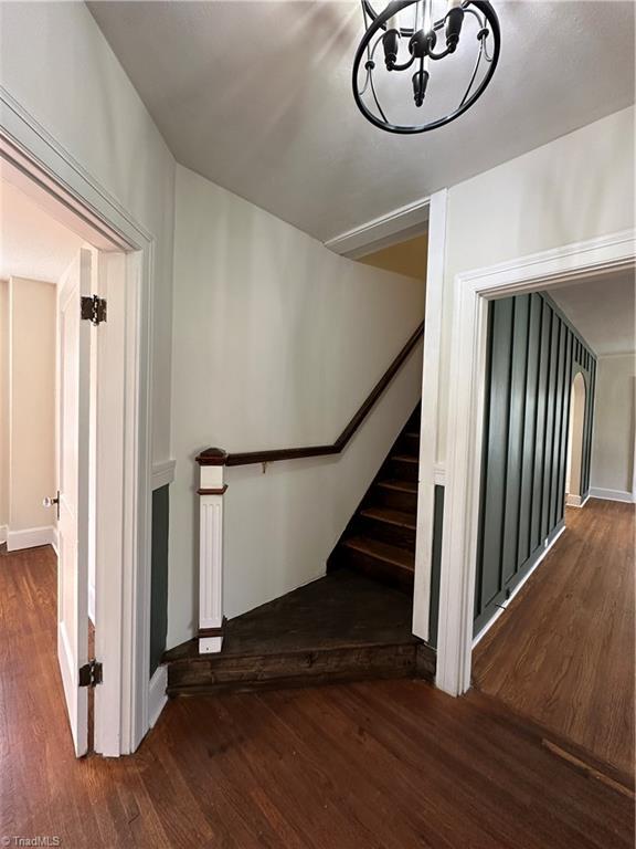 stairway with wood finished floors