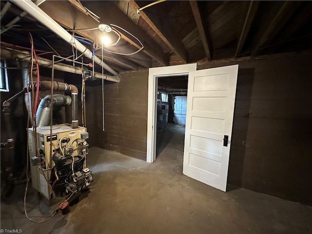 unfinished basement with a heating unit