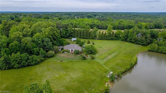 aerial view of a forest and a nearby body of water