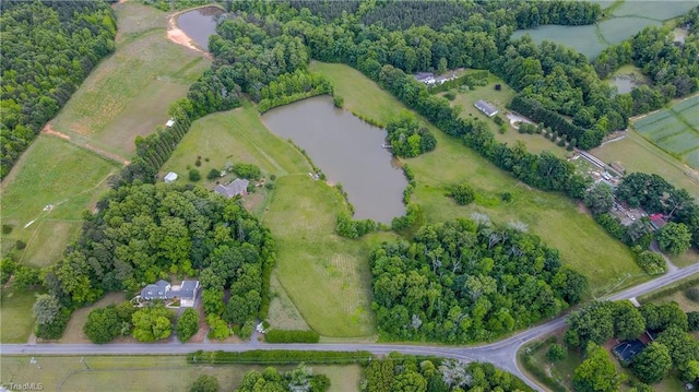 aerial view of property's location featuring a nearby body of water and rural landscape