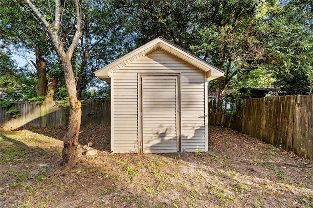 view of shed featuring a fenced backyard