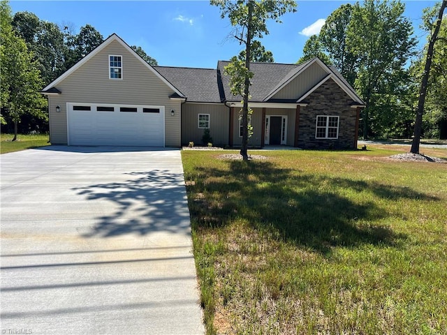 view of front of home featuring a front lawn and a garage