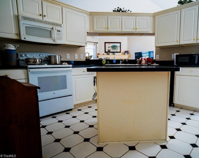 kitchen with white appliances and a kitchen island