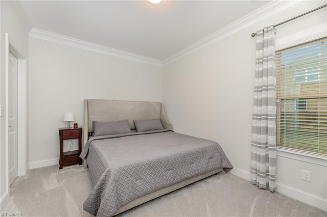 bedroom with ornamental molding and light carpet