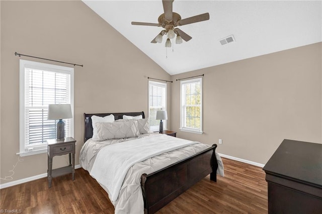 bedroom with wood finished floors, visible vents, and baseboards