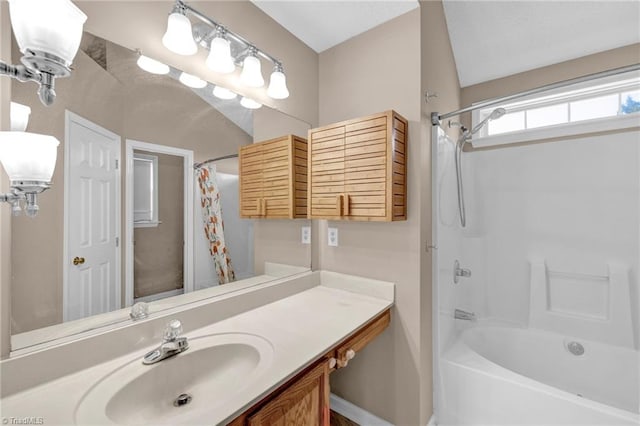 bathroom featuring shower / tub combo with curtain and vanity