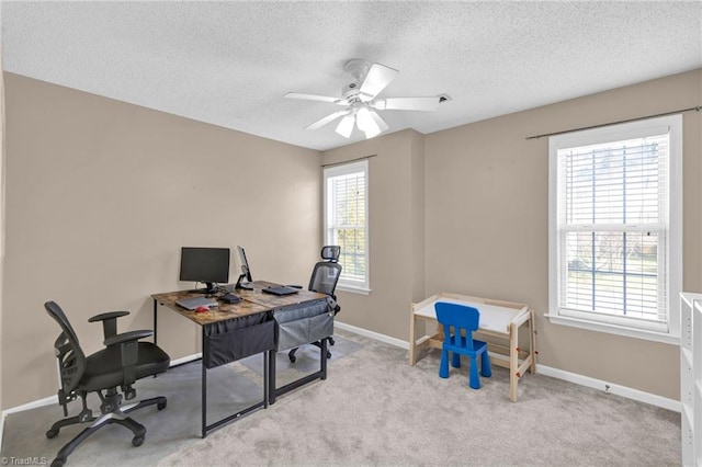 home office with a wealth of natural light, baseboards, carpet, and ceiling fan