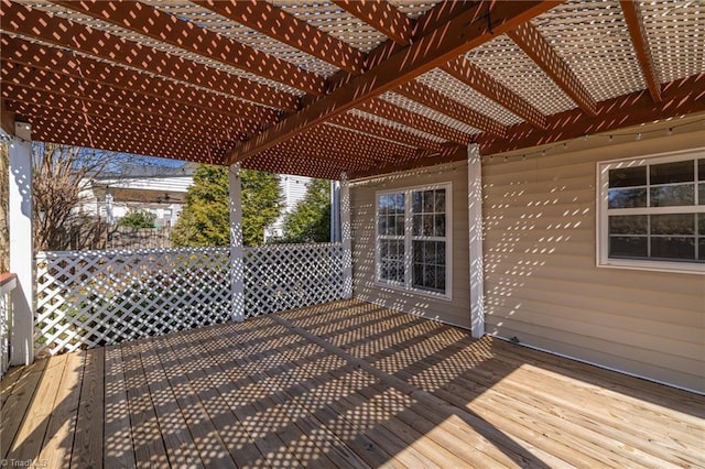 wooden deck featuring a pergola