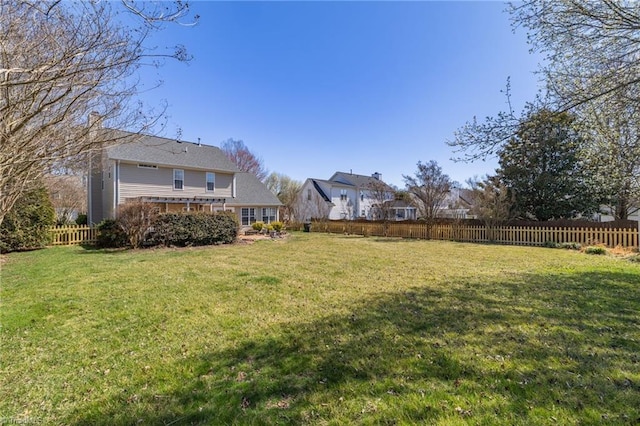 view of yard with a fenced backyard