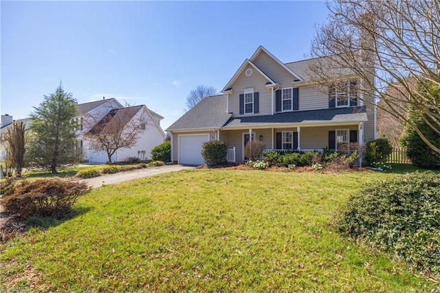 traditional-style house featuring fence, a porch, a front yard, driveway, and an attached garage