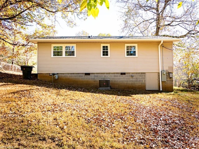 view of home's exterior with central AC unit