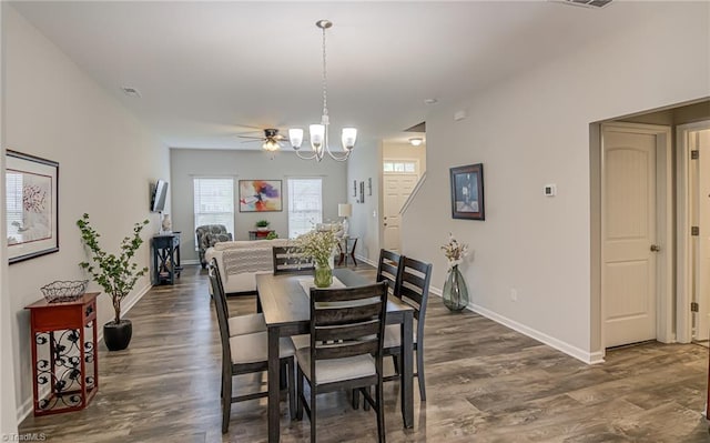 1438 Crestlawn Trl, Pfafftown, NC 27040 - dining room featuring baseboards, dark wood-style floors, and a chandelier