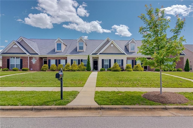 1438 Crestlawn Trl, Pfafftown, NC 27040 - townhome / multi-family property featuring a front yard and brick siding