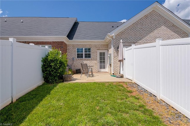 1438 Crestlawn Trl, Pfafftown, NC 27040 - back of house featuring brick siding and a patio area