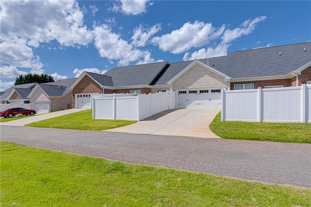 1438 Crestlawn Trl, Pfafftown, NC 27040 - view of front of home with brick siding, concrete driveway, and a garage