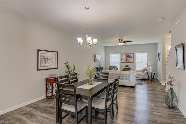 1438 Crestlawn Trl, Pfafftown, NC 27040 - dining area featuring dark wood finished floors, a ceiling fan, baseboards, and a chandelier
