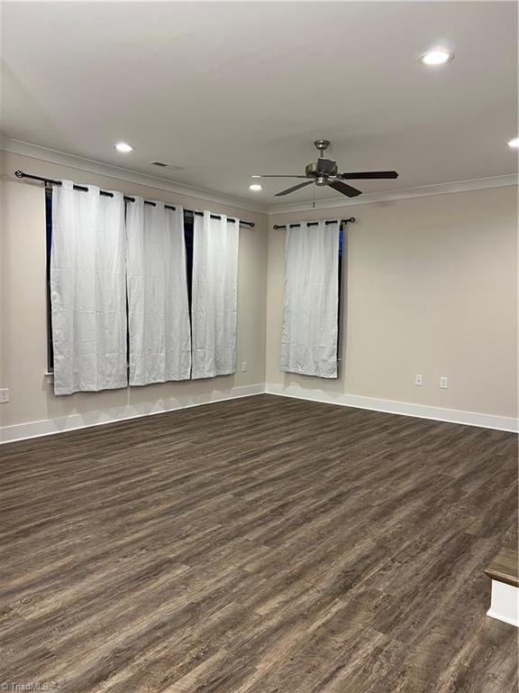 spare room featuring recessed lighting, dark wood-style floors, baseboards, and ornamental molding