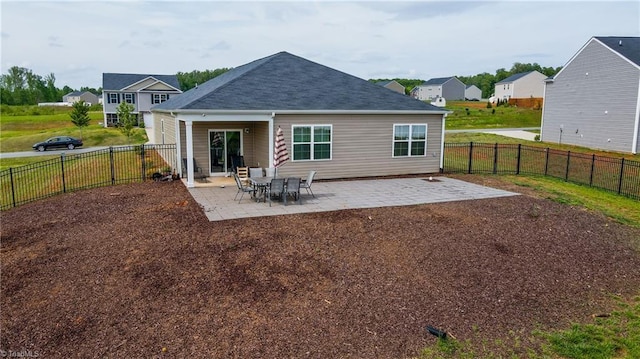 121 Argyle Ct, Mocksville, NC 27028 - rear view of house with a fenced backyard, a residential view, and a patio area