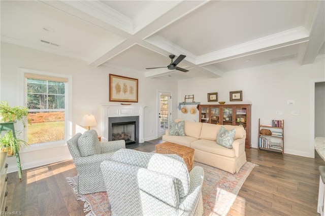 living room featuring coffered ceiling, dark hardwood / wood-style floors, beamed ceiling, and ornamental molding