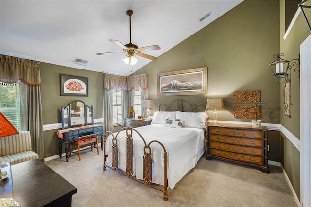 carpeted bedroom featuring lofted ceiling, a ceiling fan, and baseboards