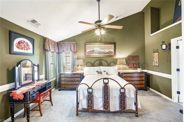 carpeted bedroom featuring lofted ceiling, baseboards, and a ceiling fan