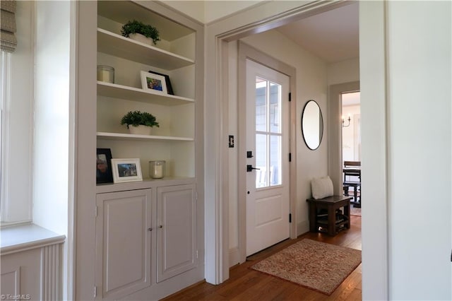 foyer featuring wood finished floors