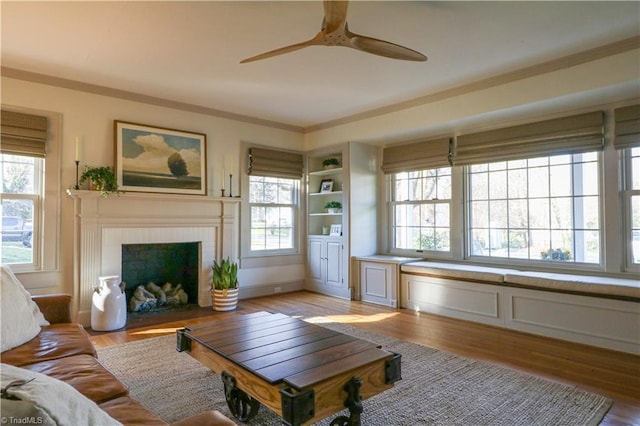 living room with light wood finished floors and plenty of natural light