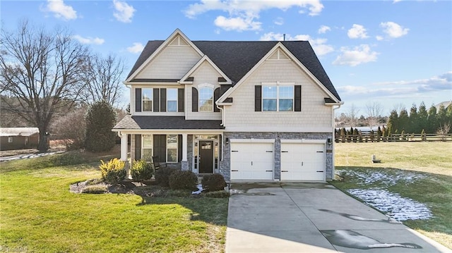 craftsman-style home featuring a front lawn, a garage, and covered porch