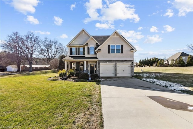 view of front of house with a front lawn, a garage, and a porch