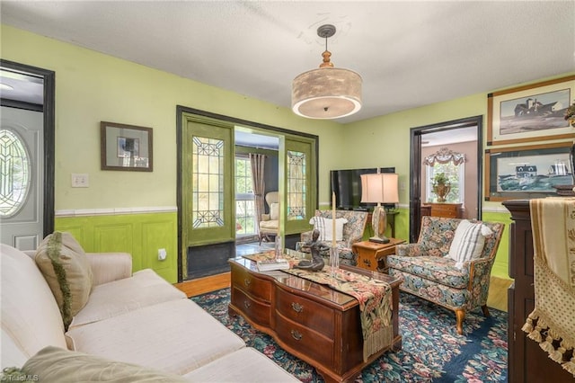 238 Maple St, King, NC 27021 - living area with plenty of natural light and wainscoting