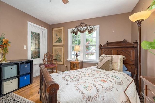 238 Maple St, King, NC 27021 - bedroom featuring light wood finished floors and a ceiling fan
