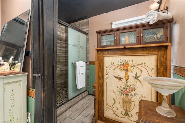 238 Maple St, King, NC 27021 - bathroom view of a stall shower and wood finish floors