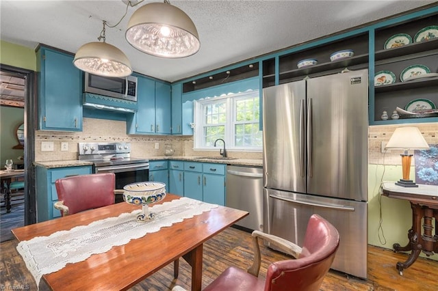 238 Maple St, King, NC 27021 - kitchen featuring appliances with stainless steel finishes, blue cabinetry, a sink, and open shelves
