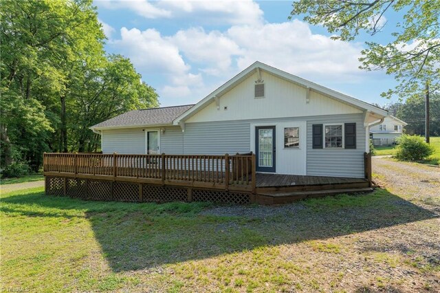 4814 Merrimac St, Winston-Salem, NC 27105 - rear view of property featuring a yard, a wooden deck, and roof with shingles