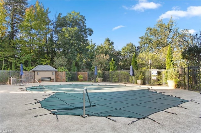 view of swimming pool featuring a patio area