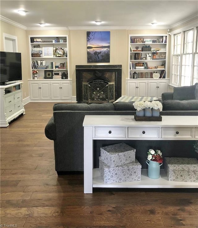 living room with crown molding, a fireplace, and dark wood-type flooring