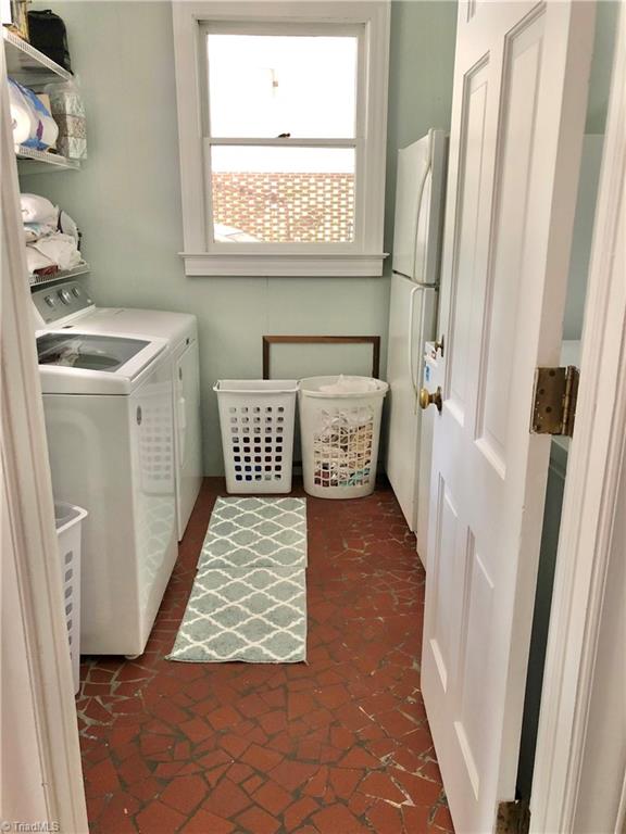 washroom with washer and dryer