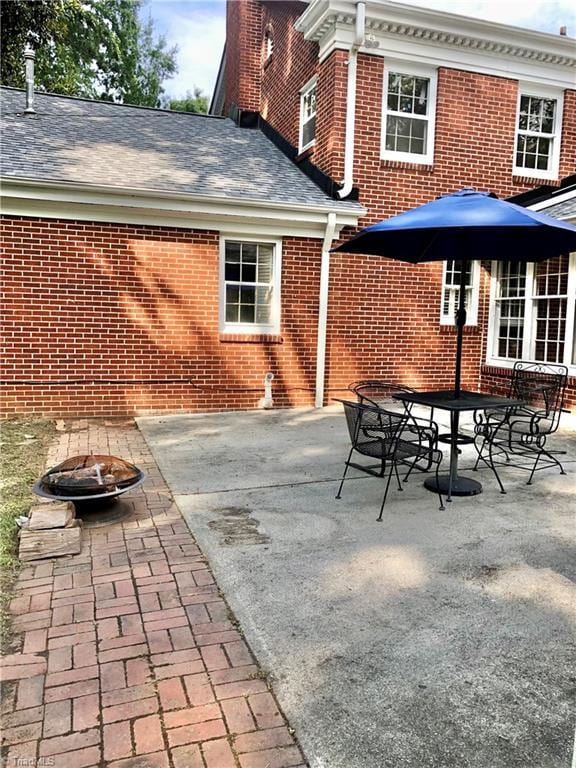 view of patio / terrace featuring an outdoor fire pit