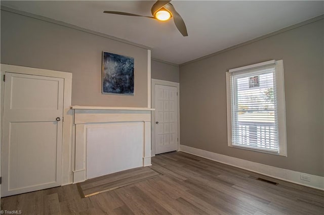 spare room with ceiling fan and hardwood / wood-style floors