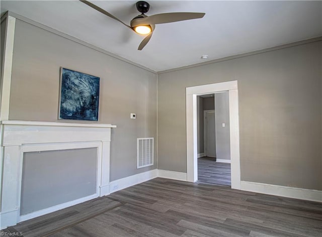 unfurnished living room with ceiling fan, dark hardwood / wood-style flooring, and crown molding