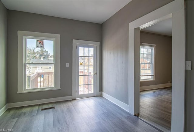 doorway with hardwood / wood-style floors