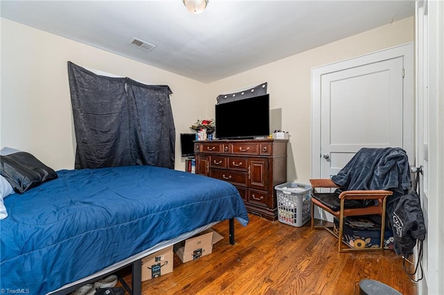 bedroom with wood finished floors