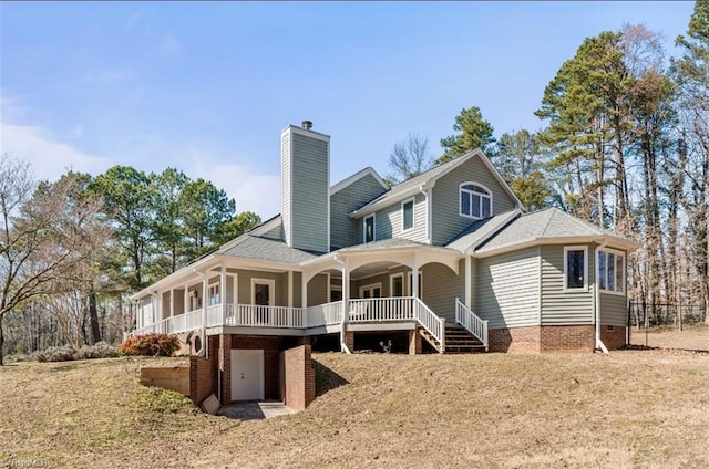 rear view of house featuring a chimney