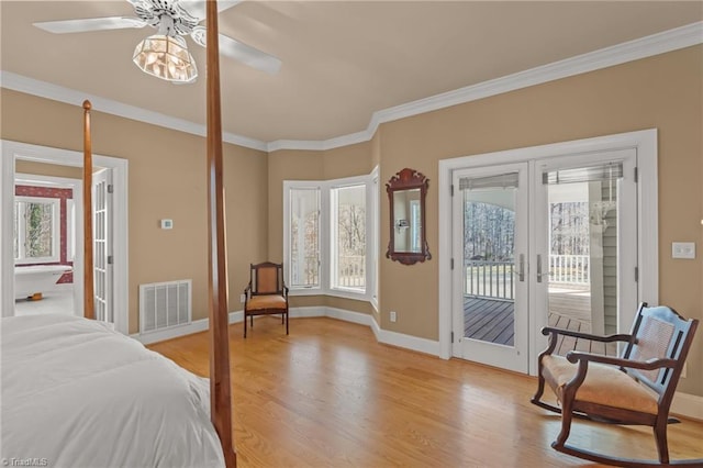 bedroom with access to outside, french doors, visible vents, ornamental molding, and light wood-type flooring