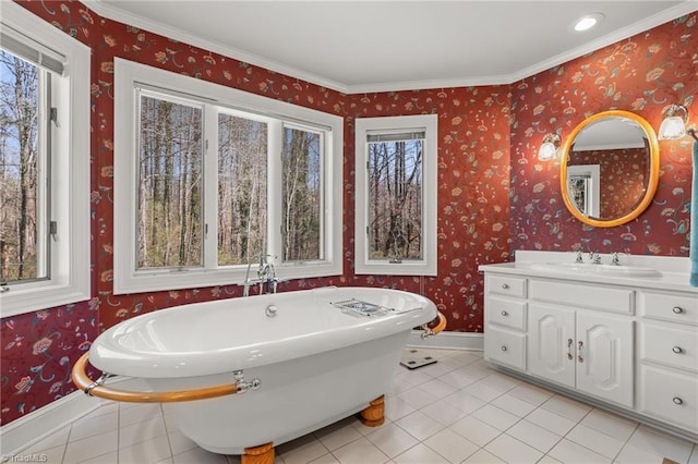 full bath with a soaking tub, a wealth of natural light, and wallpapered walls