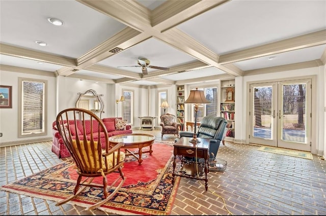 living area featuring french doors, visible vents, beamed ceiling, and baseboards