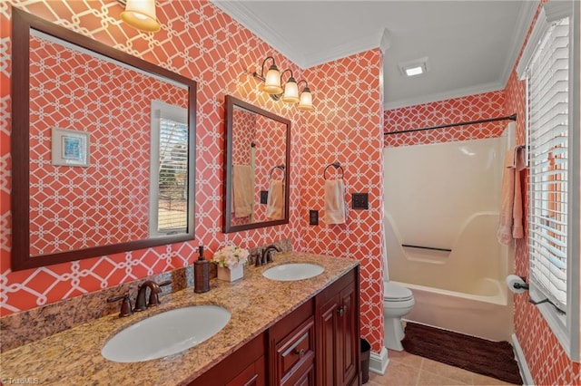 bathroom featuring ornamental molding,  shower combination, a sink, and wallpapered walls