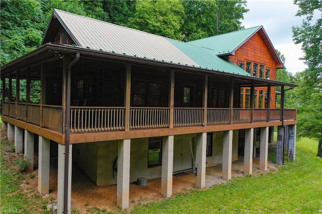 rear view of house with a yard