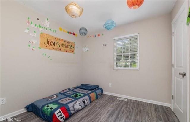 bedroom featuring hardwood / wood-style flooring